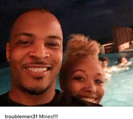 TI post a picture of himself with Zonnique with caption 'mine'.